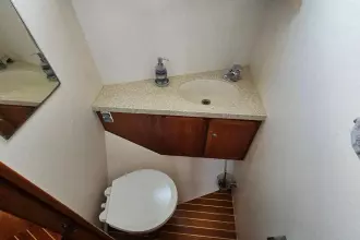 Bathroom interior of 2008 Linssen Grand Sturdy 380 AC yacht, featuring sink and toilet.