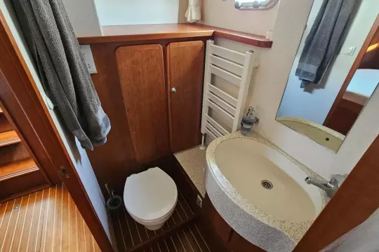 Bathroom interior of 2008 Linssen Grand Sturdy 380 AC yacht, featuring sink and toilet.