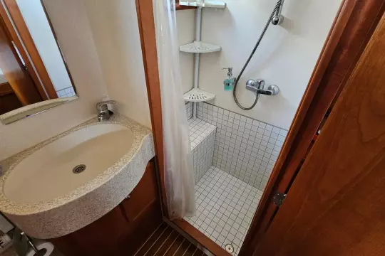 Bathroom interior of 2008 Linssen Grand Sturdy 380 AC yacht, featuring sink and shower.