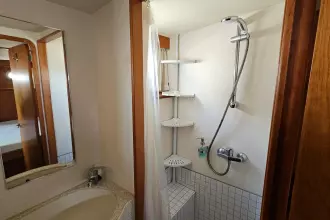 Bathroom interior of 2008 Linssen Grand Sturdy 380 AC yacht, featuring shower and sink.