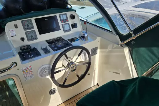 Helm of 2008 Linssen Grand Sturdy 380 AC with steering wheel and navigation controls.