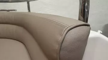 Luxurious beige seating detail on 2008 Nimbus 42 Nova boat, showcasing elegant upholstery design.