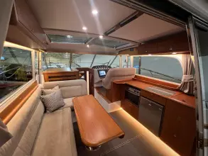 Luxurious interior of 2008 Nimbus 42 Nova yacht with modern kitchen and seating area.