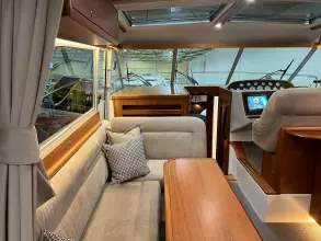 Interior of 2008 Nimbus 42 Nova yacht with plush seating and modern dashboard.