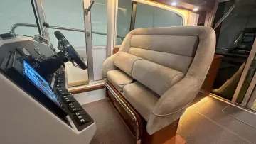 Interior of 2008 Nimbus 42 Nova boat with plush seating and modern control panel.