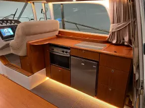 Luxurious 2008 Nimbus 42 Nova yacht interior with modern kitchen and navigation area.
