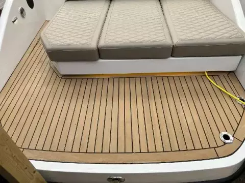 Hidden lighting under rear seat