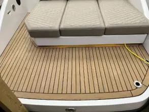 Hidden lighting under rear seat